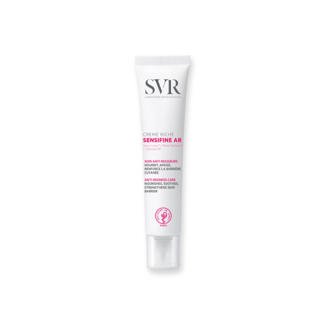 SVR Sensifine AR Creme Riche anti-redness face cream in a white squeeze tube with pink and black text on a white background.